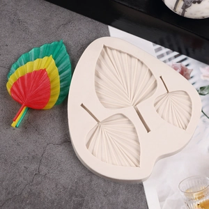 Detail of leaf texture silicone mold showing three sizes with colorful resin samples