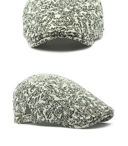 Detail of floral jacquard beret with adjustable metal buckle and vintage pattern
