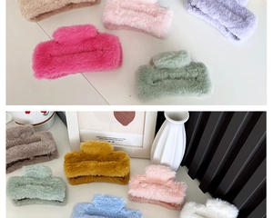 Detail showing plush square hair claws in various soft colors with faux fur texture