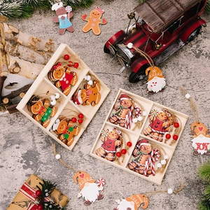 Detailed view of wooden gingerbread man and gnome Christmas ornaments in a gift box