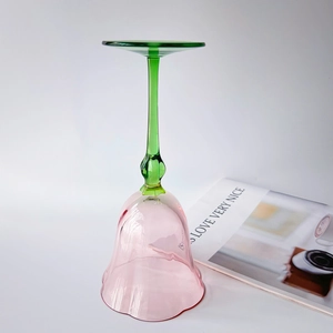 Pink tulip flower wine glass with green stem and leaf base in elegant vintage glass