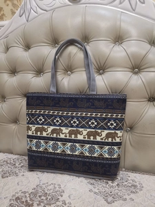 Detail of navy canvas tote bag with ethnic elephant print and geometric patterns