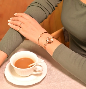 Close-up of elegant rose gold quartz watch and matching bracelet on a female wrist