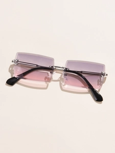 Detail shot of rimless square sunglasses with purple-pink gradient lenses and silver bridge