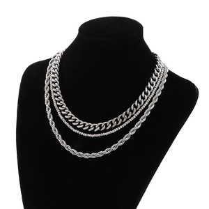 Detailed layered look of silver stainless steel Cuban, bead, and rope chain necklaces