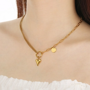Close-up of a double-layered gold heart and star pendant necklace worn by a model