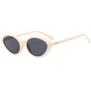 Retro oval cat eye sunglasses in beige with dark grey lenses and rivet detail