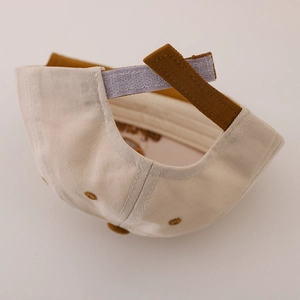 Adjustable beige cotton baby baseball cap with cute panda design and brown Velcro strap