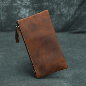 Detailed view of a brown crazy horse leather long wallet with premium zipper closure