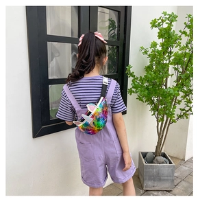 Detail of sequin unicorn waist bag with adjustable strap worn by a child