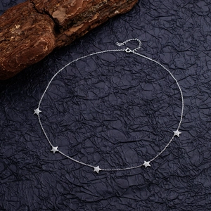 Elegant S925 sterling silver necklace with five sparkling star pendants on black background