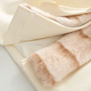 Elegant cream winter wool coat featuring a striped faux fur collar and premium texture