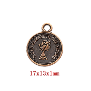Macro view of vintage bronze Elizabeth II coin pendant with embossed portrait detail
