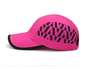 Detail view of the breathable mesh side panel on a rose red quick-dry baseball cap