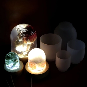 Macro detail of DIY epoxy resin crystal ball lamp and wooden LED base with silicone mold