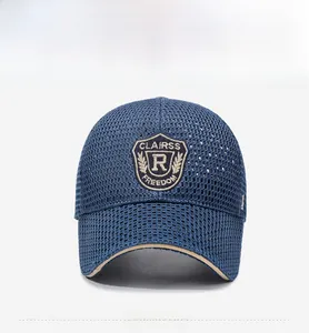 Front detail of navy mesh baseball cap with shield embroidery and khaki underbrim