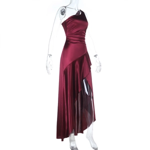 Detail of burgundy satin one-shoulder dress with elegant pleats and asymmetrical hemline
