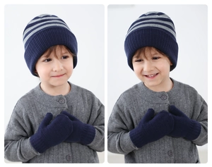 Detail of kids navy and grey striped knit hat and matching gloves set on a boy