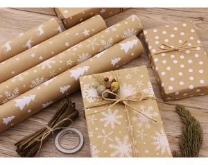 Detail of vintage kraft Christmas wrapping paper with reindeer and snowflake patterns