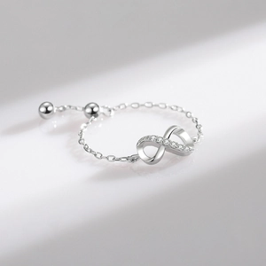 Adjustable sterling silver chain ring featuring a micro-paved infinity symbol design