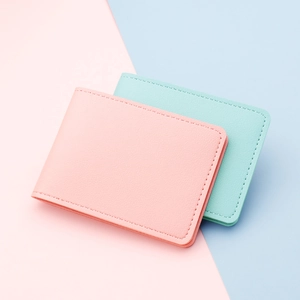 Slim minimalist PU leather card holder wallet in pastel pink and mint green finishes