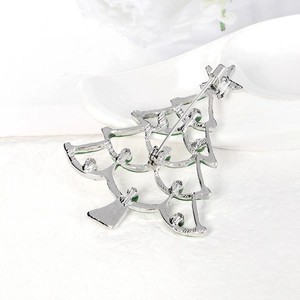 Green enamel Christmas tree brooch with silver metal backing and secure pin clasp