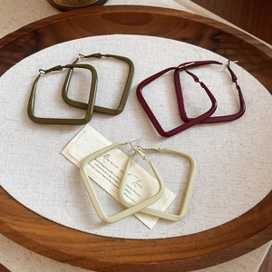 Detail of geometric square hoop earrings in olive green, wine red, and milk tea matte finish