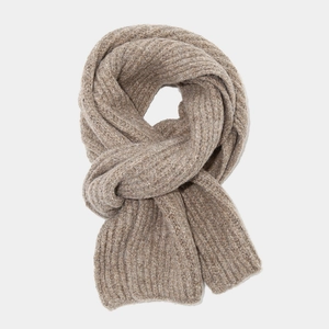Detail of camel rib-knit scarf showing thick wool texture and elegant drape styling