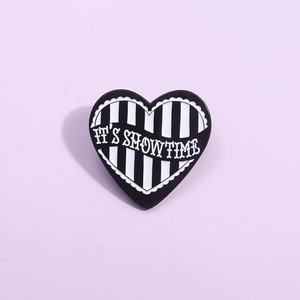 Creative black and white striped heart enamel pin with IT'S SHOWTIME slogan