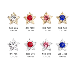 Star-shaped alloy nail charms with vibrant rhinestones in gold and silver settings