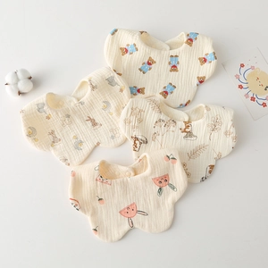 Detailed view of 4-pack petal-shaped muslin cotton baby bibs with cute animal prints