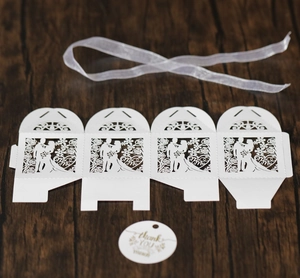 Detailed laser cut Mr & Mrs wedding favor box with white ribbon and thank you tag