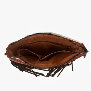 Internal structure of brown bohemian fringe bag with zipper pocket and dual storage slots