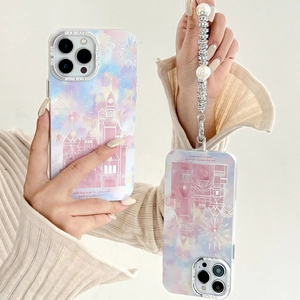 Detail showing pink castle phone case with elegant pearl rhinestone bracelet strap