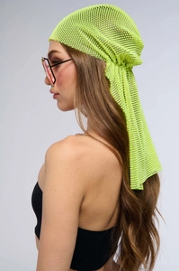 Detailed view of neon green rhinestone head wrap with glittering mesh crystal pattern