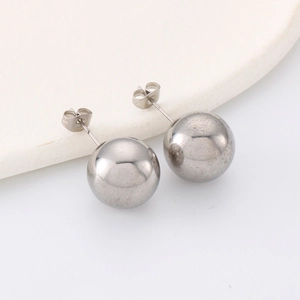 Close-up of polished gold-plated stainless steel ball stud earrings with pin backing