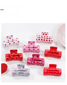 Detail of 8-piece square hair claw clips with heart patterns and love letter prints