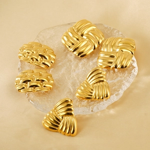 Detailed macro view of 18k gold plated stainless steel square and geometric stud earrings