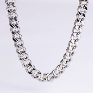Detail of polished silver cuban link chain with thick interlocking stainless steel rings