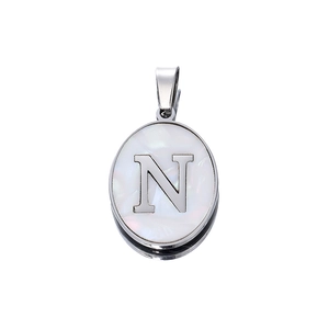 Detail of silver oval pendant with white mother of pearl inlay and capital letter N