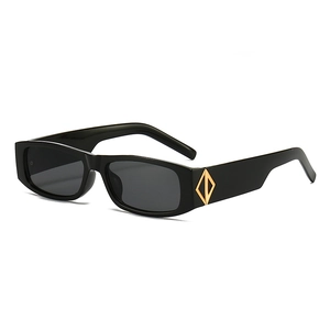 Rectangle sunglasses with black narrow frames and gold metal accents on wide temples