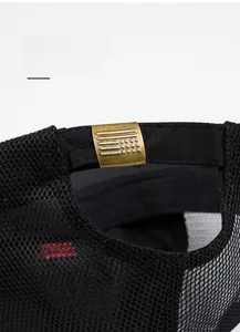 Close-up of adjustable bronze metal buckle on breathable mesh baseball cap detail