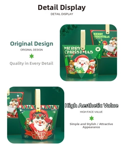 Detail of green Christmas gift box with leather handle and festive cartoon illustrations