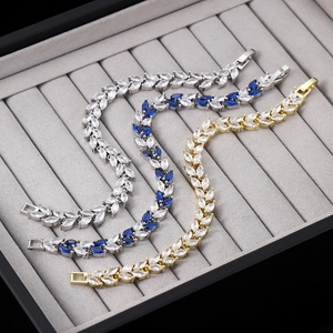 Elegant marquise-cut crystal leaf bracelets in silver and gold with secure folding clasps