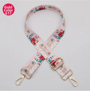 Close-up of pink Christmas strap with gold hardware and Merry Christmas lettering