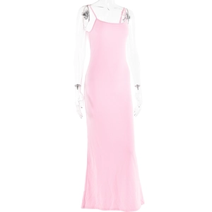 Detailed close-up of a pink backless slim-fit maxi dress with cross-straps on a mannequin