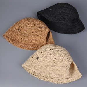 Detailed knit texture of breathable straw bucket hats in black, tan and beige