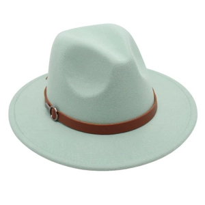 Detail of mint green wool fedora hat featuring a brown leather band and metal buckle