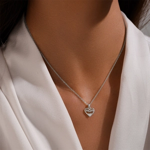 Close-up of S925 silver heart necklace with MOM lettering and zircon stones