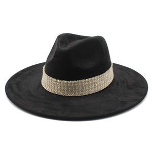 Classic black suede wide brim fedora hat featuring an elegant woven gold trim band